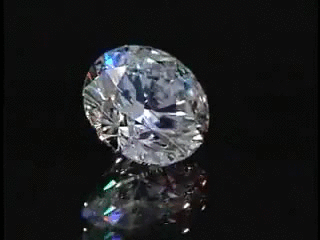 IGI certified 4ct D color diamond VVS1 VVS2 3EX sparkling on black reflective surface